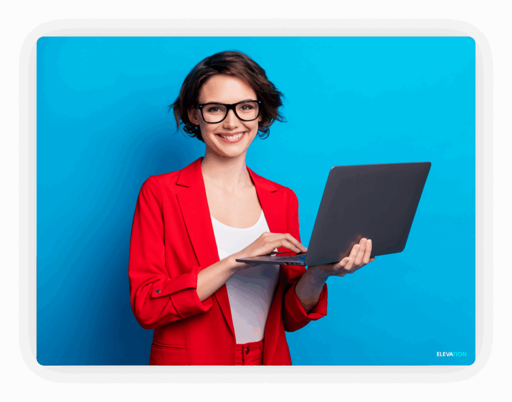 Female digital marketing professional holding a laptop