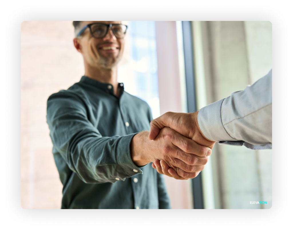 Business man shaking another business man's hand