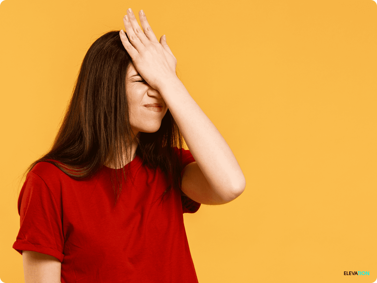 Frustrated woman holding her hand to her forehand