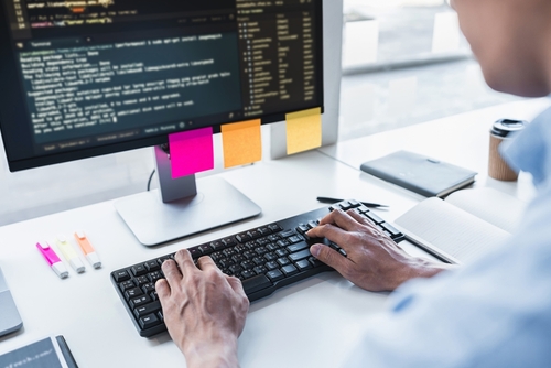 Man programming in his computer