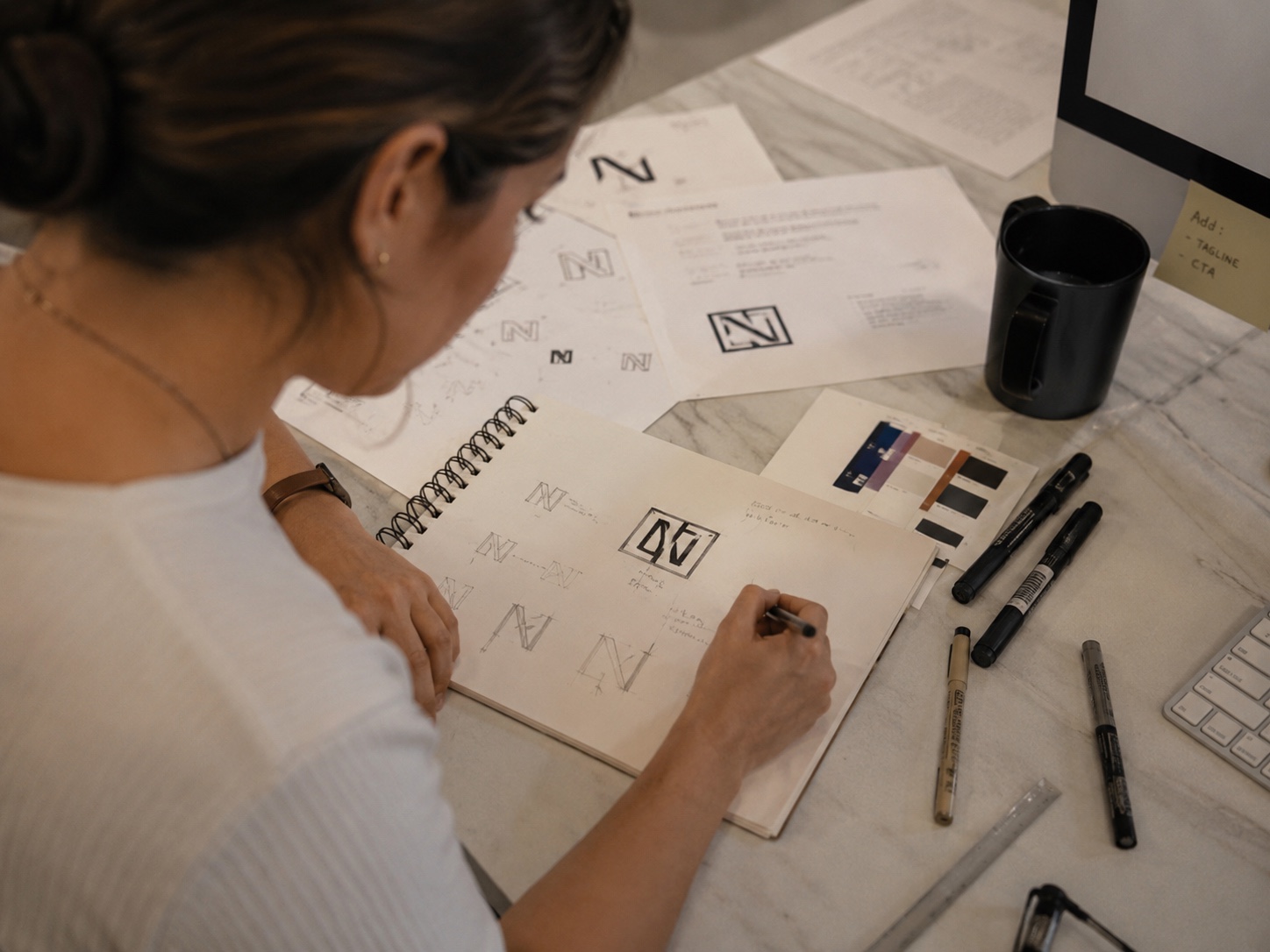 Sketching nonprofit logo concepts by hand