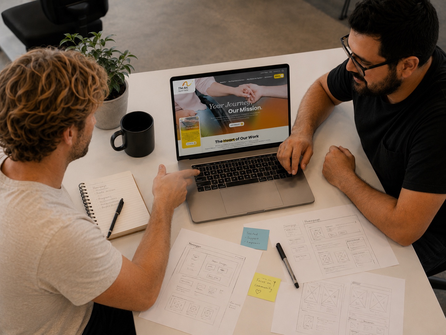 Reviewing homepage wireframes and the finished nonprofit website