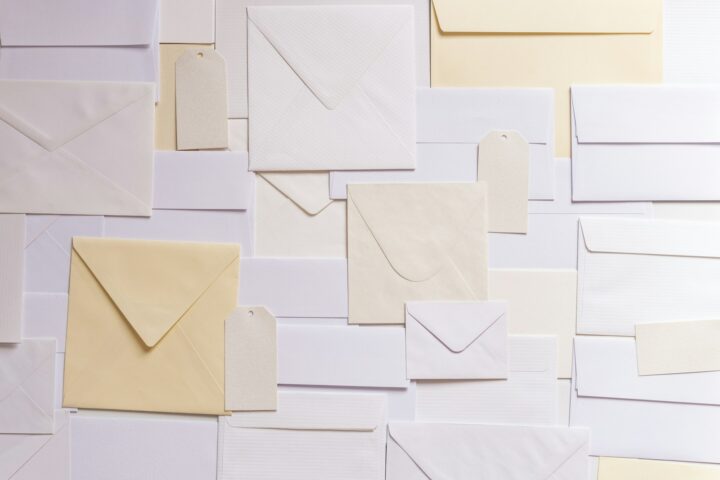 Flat lay of white and cream paper envelopes
